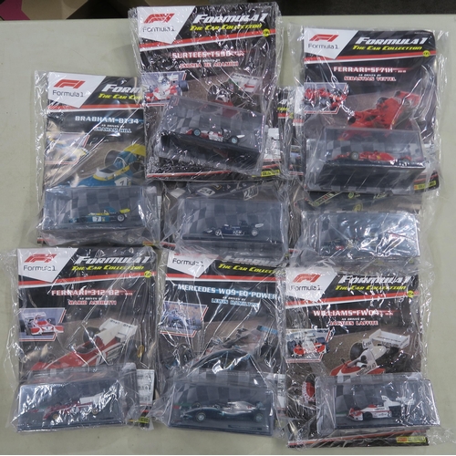 401 - A large quantity of Formula 1: The Car Collection model vehicles, produced by Panini Collections, wi... 