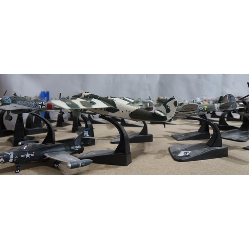 406 - A quantity of Fighter Aircraft Collection die-cast model military aeroplanes, with various accompany... 