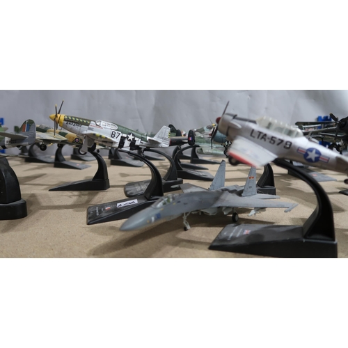 406 - A quantity of Fighter Aircraft Collection die-cast model military aeroplanes, with various accompany... 