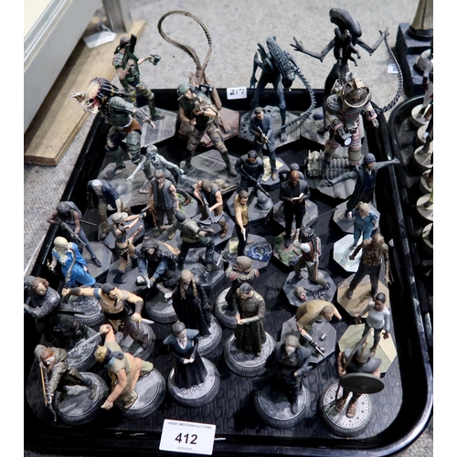 412 - A large quantity of HBO Games of Thrones, Walking Dead and Assassin's Creed resin figurines, with ac... 