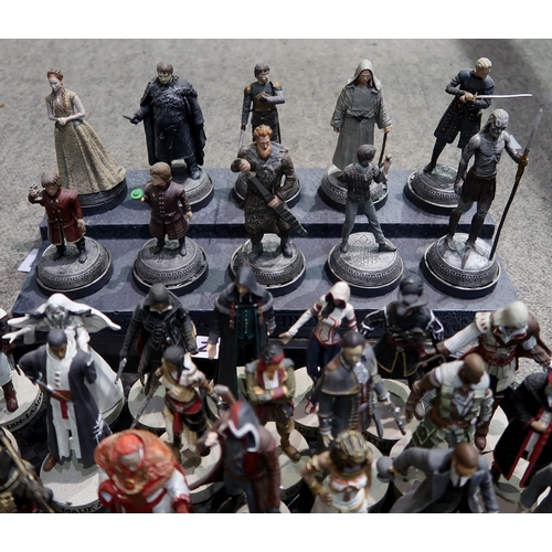 412 - A large quantity of HBO Games of Thrones, Walking Dead and Assassin's Creed resin figurines, with ac... 