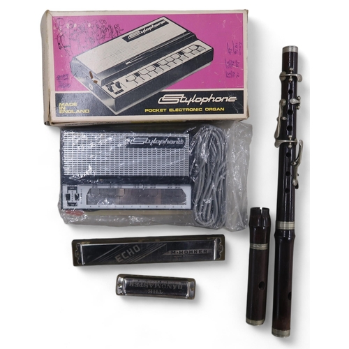 417 - A boxed Stylophone Pocket Electric Organ; Hohner Echo and Bandmaster harmonicas; a wooden flute, wit... 