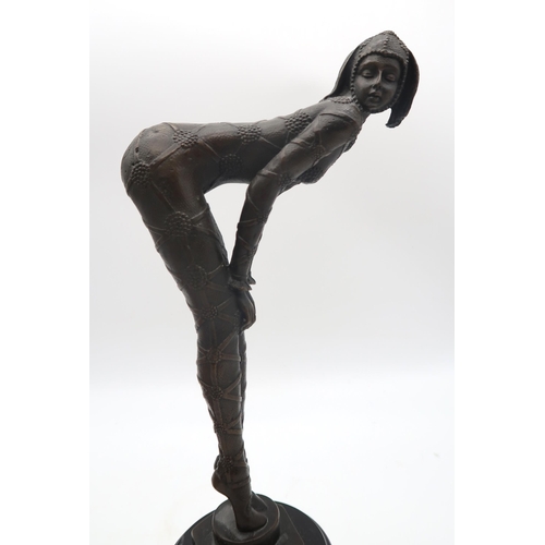 160 - An Art Deco style figure of a dancer with a pole, signed Milo, together with another figure