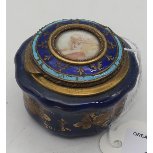 171 - A 19th century porcelain pill box, with enamelled brass lid and portrait of a lady