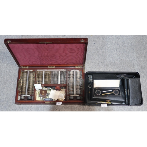 188 - A mahogany box of ophthalmic lenses by Giroux Paris and other accessories