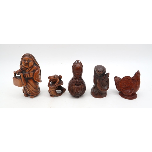 210 - A group of carved wooden netsuke