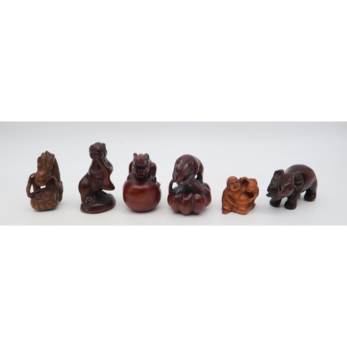 210 - A group of carved wooden netsuke