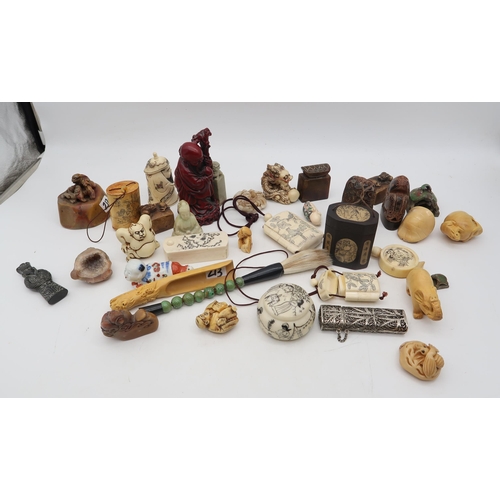 213 - Assorted netsuke and inro's in wood, stone, bone, resin etc