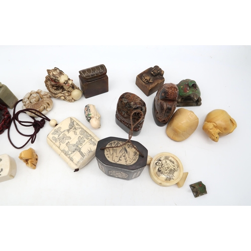 213 - Assorted netsuke and inro's in wood, stone, bone, resin etc