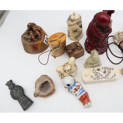 213 - Assorted netsuke and inro's in wood, stone, bone, resin etc