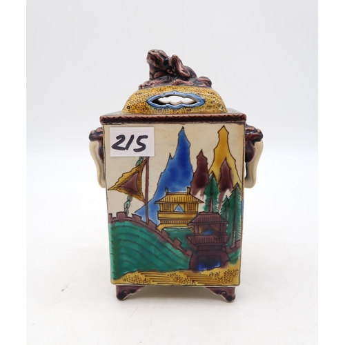 215 - A Japanese teapot in the form of a tree with birds, a glazed ceramic pot with fo dog finial, a stone... 