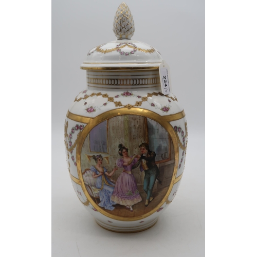 224 - A BPM (Buckauer Porzellan-Manufaktur) urn, transfer printed and overpainted with a interior scene of... 