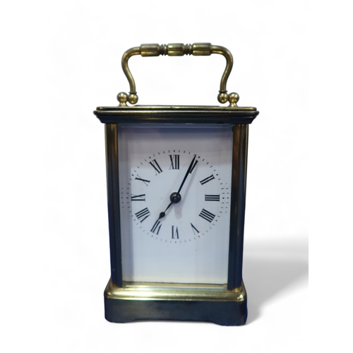 226A - A brass and glass carriage clock