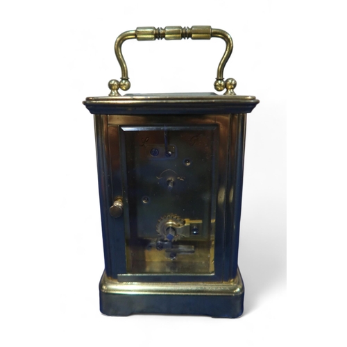 226A - A brass and glass carriage clock