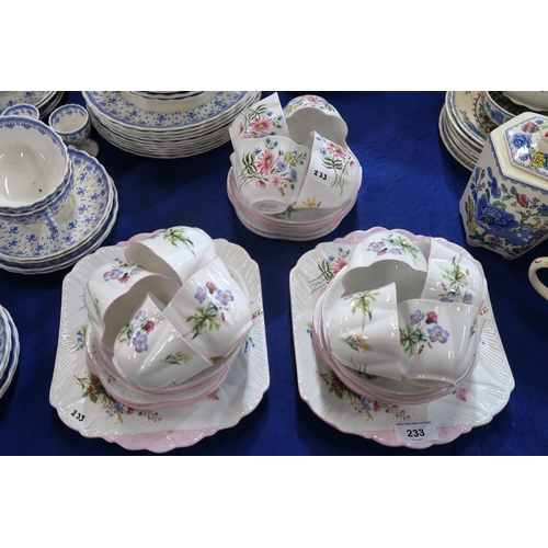 233 - A Shelley Wild Flowers pattern tea service comprising twelve cups and saucers, ten plates and t... 