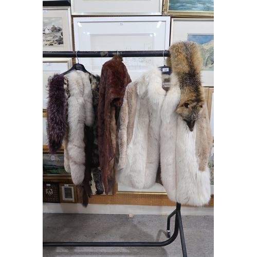 248 - A Karter white fur coat, fur stoles and scarves