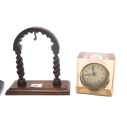 153 - A gilded Art Nouveau clock, a silvered front clock case, a rock crystal watch stand, a wooden exampl... 