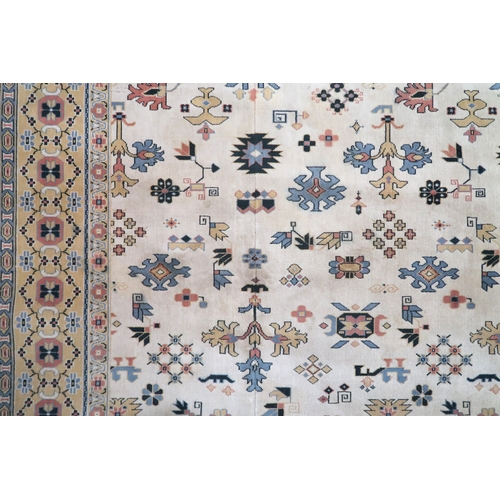 2137A - AN EXCEPTIONAL LARGE IVORY GROUND OUSHAK STYLE CARPET with all-over geometric patterned ground withi... 