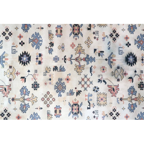 2137A - AN EXCEPTIONAL LARGE IVORY GROUND OUSHAK STYLE CARPET with all-over geometric patterned ground withi... 