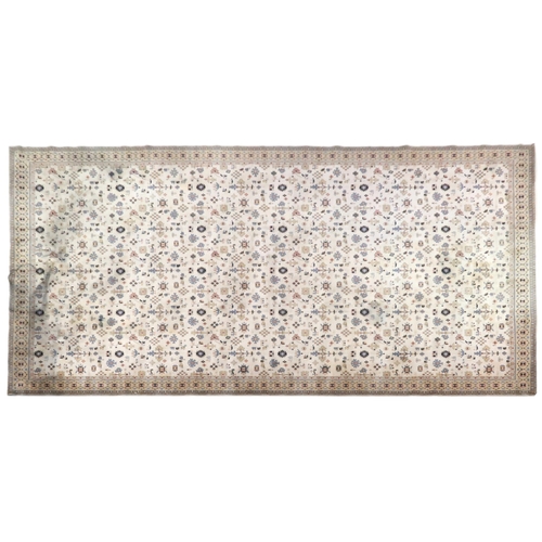 2137A - AN EXCEPTIONAL LARGE IVORY GROUND OUSHAK STYLE CARPET with all-over geometric patterned ground withi... 