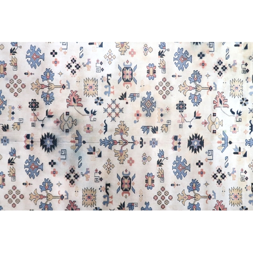 2137A - AN EXCEPTIONAL LARGE IVORY GROUND OUSHAK STYLE CARPET with all-over geometric patterned ground withi... 