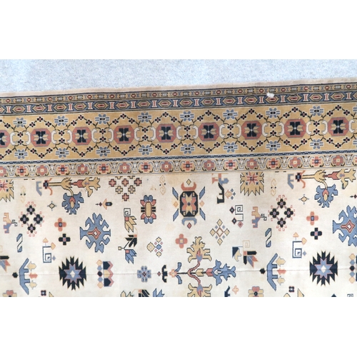 2137A - AN EXCEPTIONAL LARGE IVORY GROUND OUSHAK STYLE CARPET with all-over geometric patterned ground withi... 