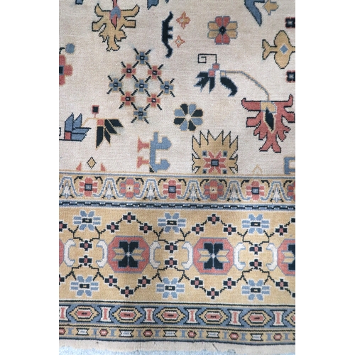 2137A - AN EXCEPTIONAL LARGE IVORY GROUND OUSHAK STYLE CARPET with all-over geometric patterned ground withi... 