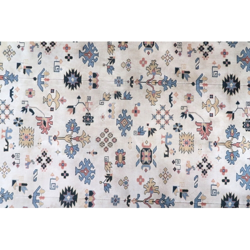 2137A - AN EXCEPTIONAL LARGE IVORY GROUND OUSHAK STYLE CARPET with all-over geometric patterned ground withi... 