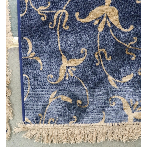 103 - A pair deep blue ground full pile Kashmir Zeigler rug with floral pattern and gilt fringes, 173cm lo... 