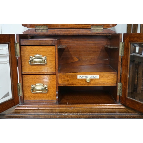 11 - A lot comprising a 20th century oak glazed door smokers cabinet, 30cm high x 40cm wide x 22cm deep a... 