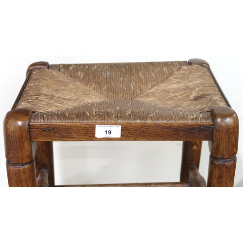 19 - A late 19th/early 20th century Arts & Crafts rushed feet stool with turned supports joined by tu... 