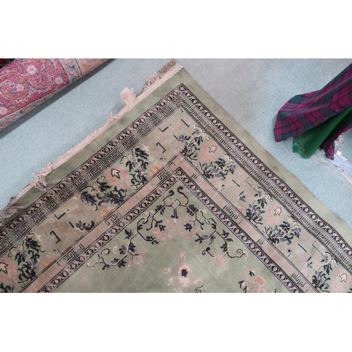 25 - A large green ground Oriental Templeton style carpet with dark circular central medallion on floral ... 