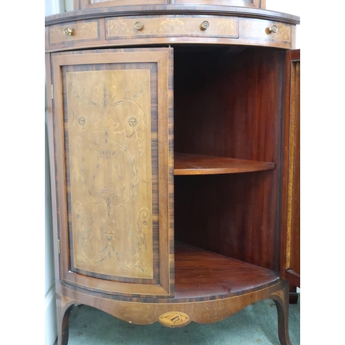28 - A 20th century mahogany and fruitwood inlaid Regency style bow front corner cabinet with pair of gla... 