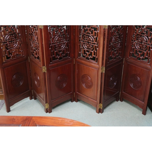 38 - A 20th century Chinese hardwood six fold room divider with carved pierced panels, 183cm high x 46cm ... 