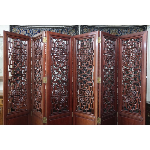 38 - A 20th century Chinese hardwood six fold room divider with carved pierced panels, 183cm high x 46cm ... 