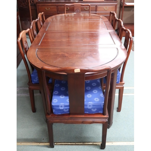 42 - A 20th century Chinese hardwood extending dining table and eight chairs (two carvers and six regular... 