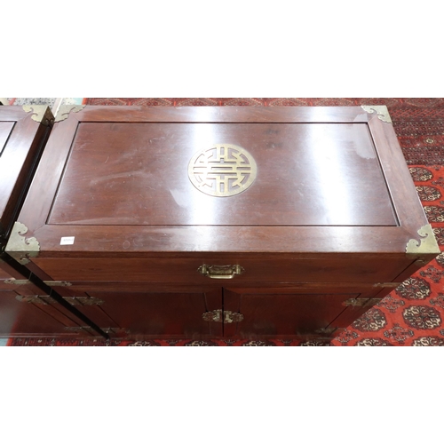 45 - A pair of 20th century Chinese brass bound side cabinets with single drawers over pairs of cabinet d... 