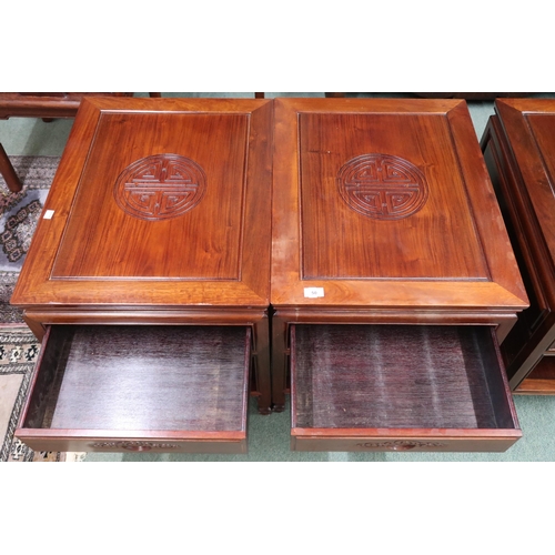 50 - A pair of 20th century Chinese hardwood single drawer hall tables with squared supports joined by lo... 