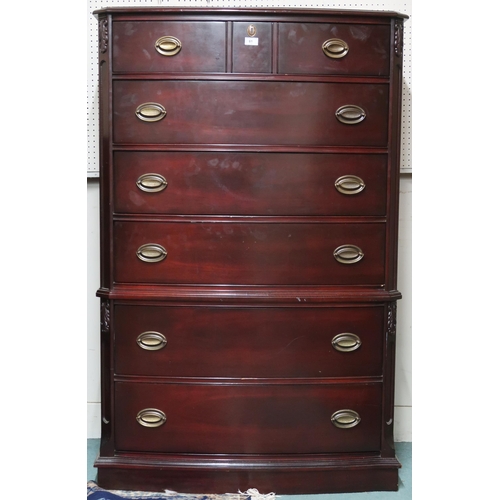 61 - A 20th century mahogany veneered bow front six drawer chest on plinth base, 147cm high x 96cm wide x... 