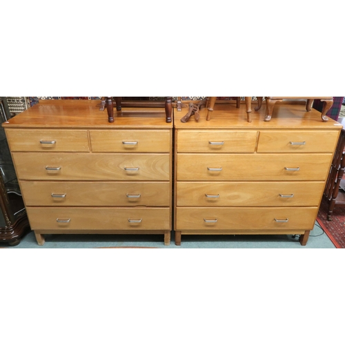 81 - A pair of mid 20th century teak two over three chests of drawers on shaped supports, 100cm high x 10... 