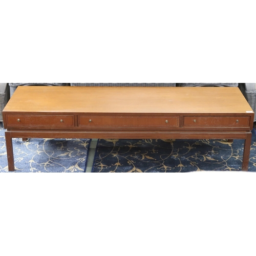 82 - A mid 20th century teak Greaves & Thomas coffee table with three drawers on square supports, 41c... 