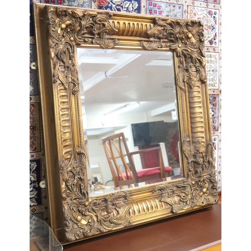 84 - A 20th gilt Rococo style bevelled glass wall mirror, 91cm x 81cm