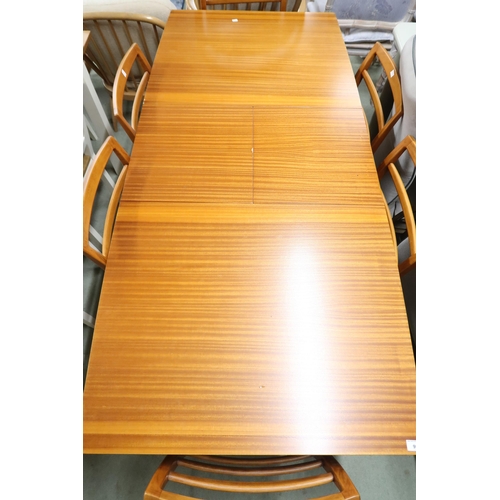 95 - A mid 20th century teak Beithcraft extending dining table and six chairs, dining table with square t... 