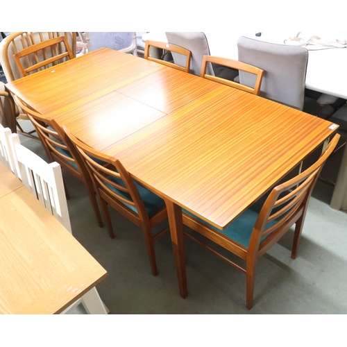 95 - A mid 20th century teak Beithcraft extending dining table and six chairs, dining table with square t... 