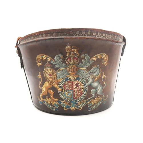 549 - A partial Victorian leather top hat case decorated with a royal coat of arms; together with a framed... 