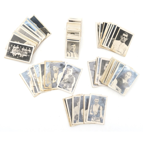 561 - A quantity of football, boxing and cricket photographic collectors' cards, circa-1920s, issued by bo... 