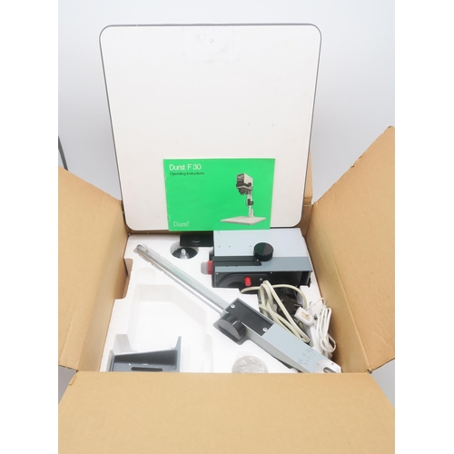 628 - A boxed Durst F30 darkroom enlarger, together with a quantity of a further boxed photographic develo... 