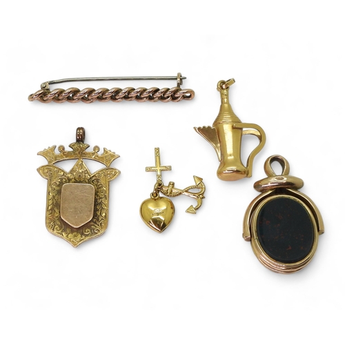 765 - A 10k gold double sided swivel fob seal 'locket' weight 7.4gms, three 9ct items; medallion, chain br... 