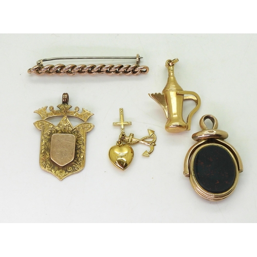 765 - A 10k gold double sided swivel fob seal 'locket' weight 7.4gms, three 9ct items; medallion, chain br... 