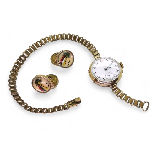 767 - A 9ct gold watch head, diameter 2.8cm, approx weight with mechanism 15.5gms with gold plated strap, ... 